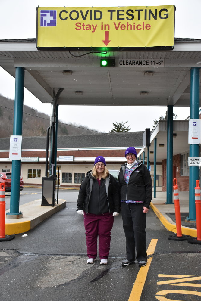 Lab technologists Holly Meyer, left, and Nancy O’Connell at the COVID-19 drive-through testing site at the Stourbridge Complex in Honesdale before dressing in their PPE.